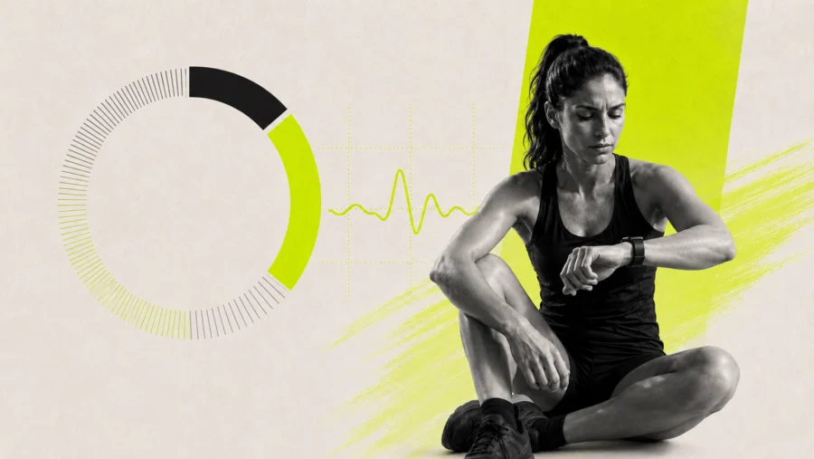 Runner checking a wearable recovery score after training